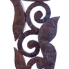 Patinated hammered copper over carved wood
